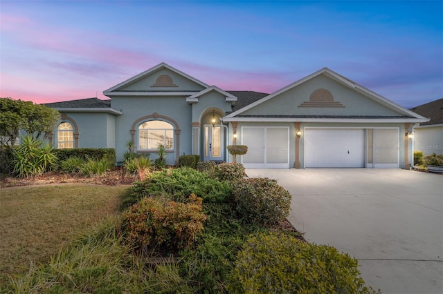 ranch-style home featuring a garage