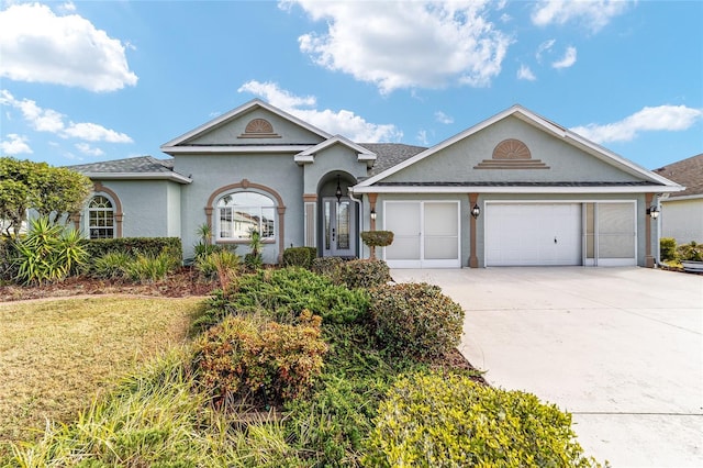 single story home with a garage