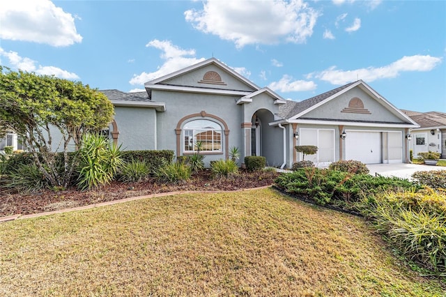 ranch-style house with a front yard and a garage