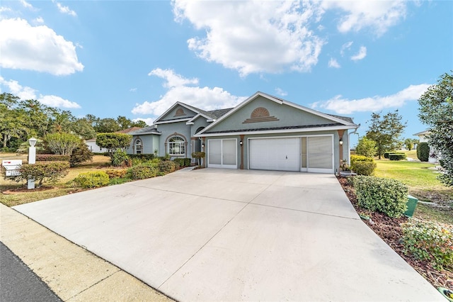 view of front of property with a garage