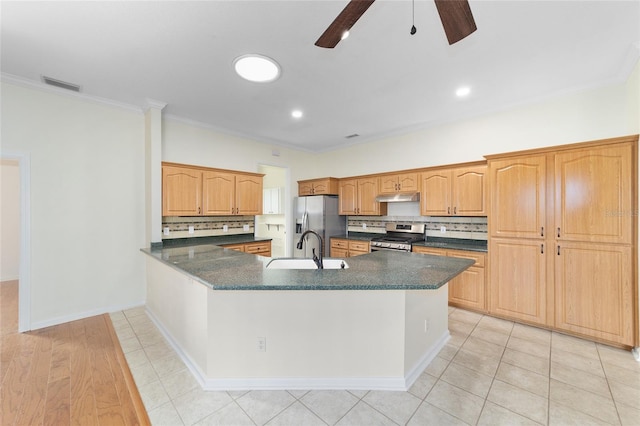 kitchen featuring stainless steel appliances, crown molding, and sink