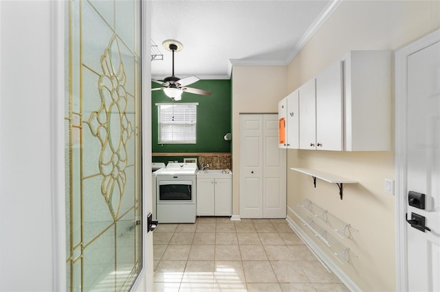 interior space featuring ceiling fan, cabinets, crown molding, light tile patterned flooring, and washer and dryer