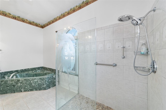 bathroom with tile patterned floors and separate shower and tub