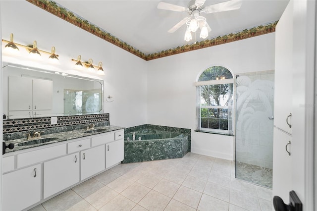 bathroom featuring tile patterned flooring, vanity, ceiling fan, and separate shower and tub