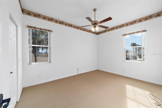 carpeted empty room with ceiling fan