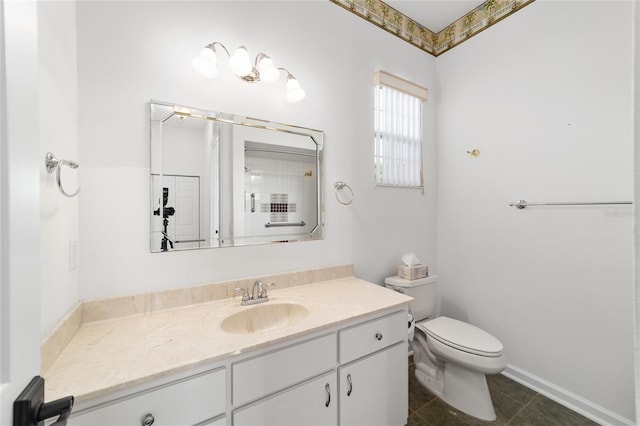 bathroom featuring tile patterned floors, vanity, and toilet