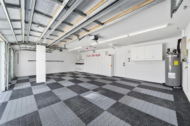 garage with water heater and a garage door opener