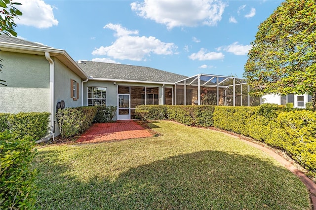 view of yard featuring a lanai