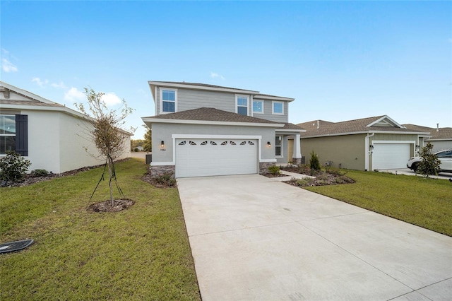 view of front of house with a front yard and a garage