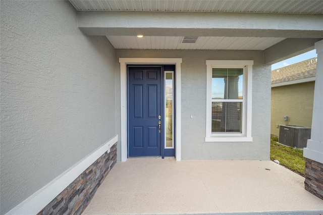 doorway to property with cooling unit