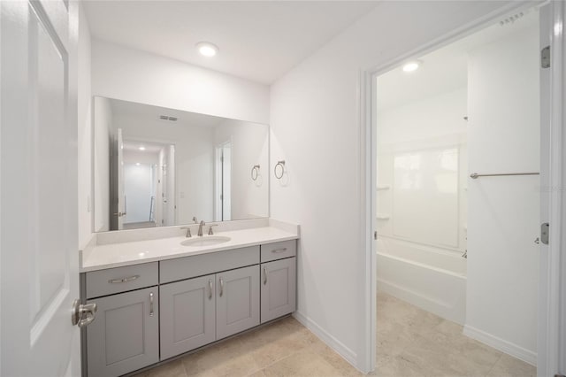 bathroom with tile patterned flooring and vanity