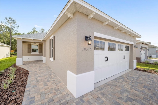 view of side of property featuring a garage