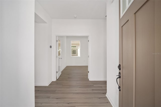 corridor featuring light wood-type flooring