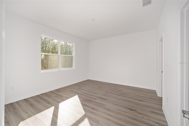 empty room featuring hardwood / wood-style floors