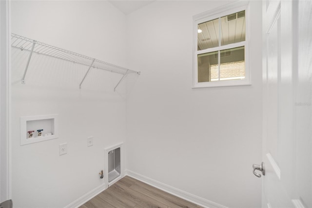 laundry room with washer hookup, electric dryer hookup, hookup for a gas dryer, and wood-type flooring