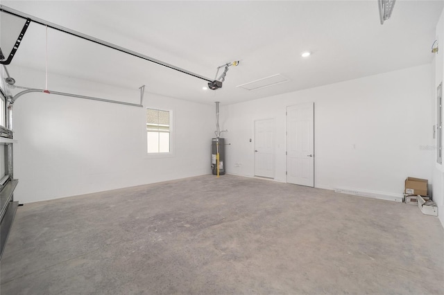 garage with gas water heater and a garage door opener