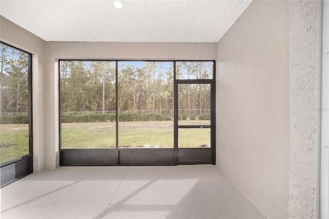 unfurnished sunroom with a healthy amount of sunlight