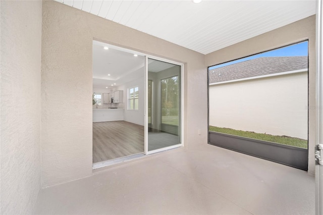 unfurnished sunroom with a wealth of natural light