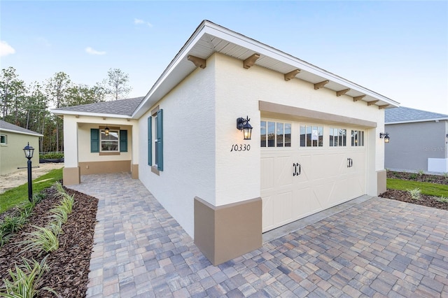 view of side of property featuring a garage