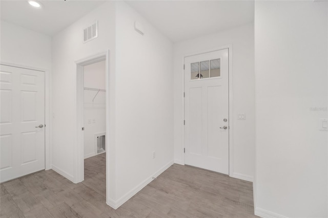 foyer entrance with light wood-type flooring