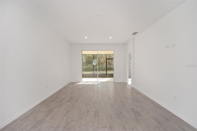 unfurnished room featuring light hardwood / wood-style floors