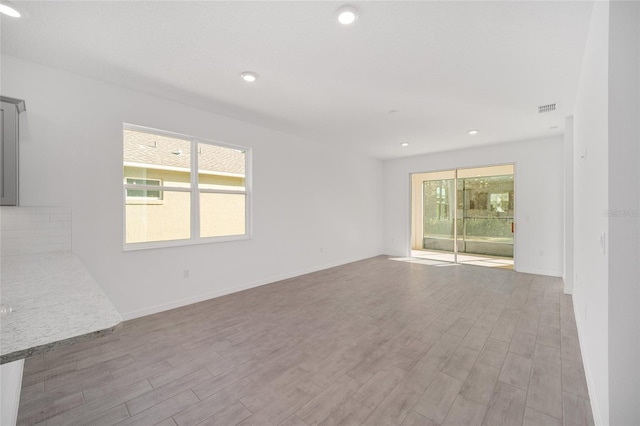 spare room with light wood-type flooring