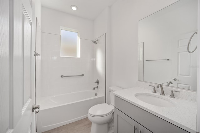 full bathroom with vanity, toilet, and tiled shower / bath