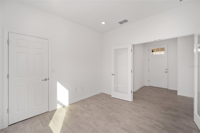 entrance foyer featuring french doors and light wood-type flooring