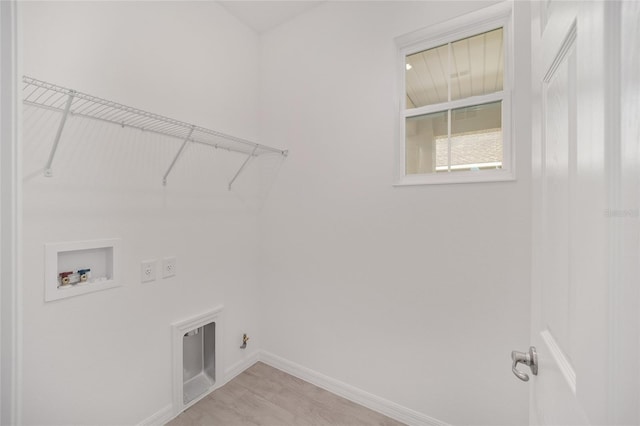 clothes washing area with electric dryer hookup, hookup for a gas dryer, washer hookup, and light wood-type flooring