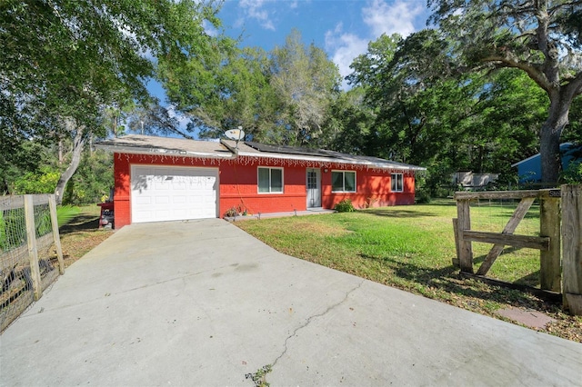 ranch-style house featuring a garage, a front yard, and solar panels