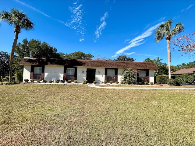 ranch-style home with a front yard