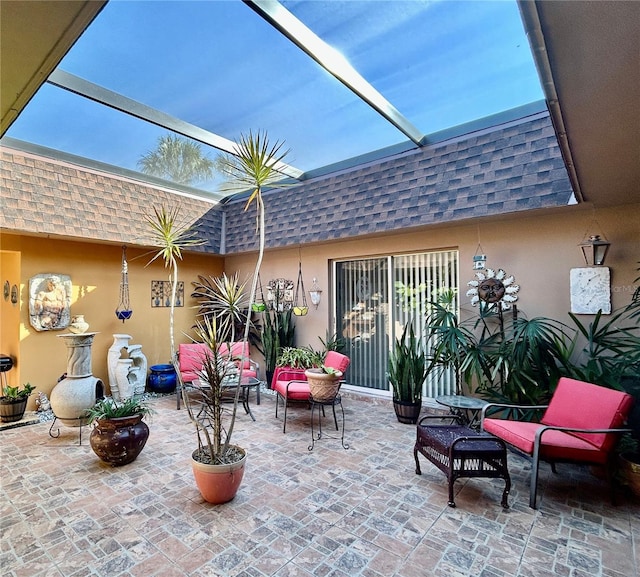 view of patio with a lanai