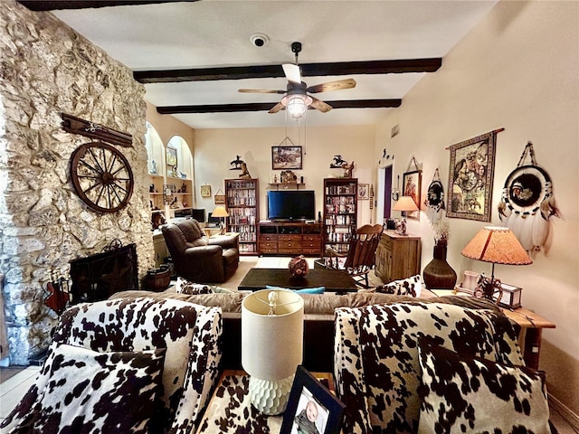 living room with beamed ceiling and ceiling fan