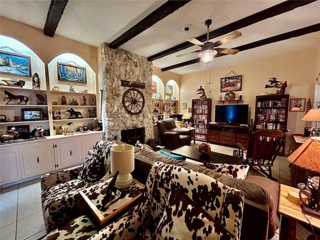 tiled living room featuring beamed ceiling and ceiling fan