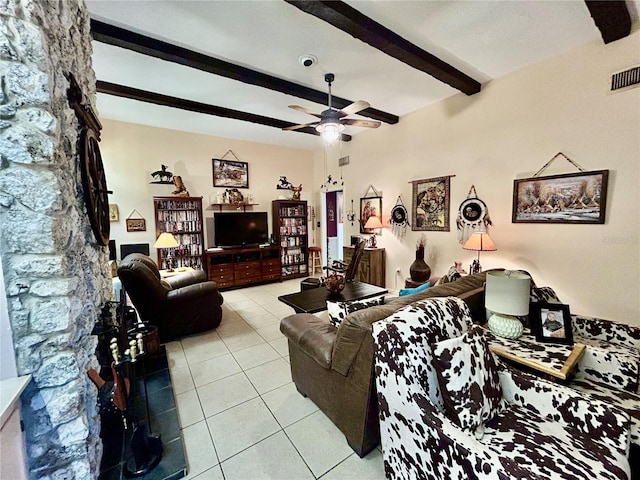 tiled living room with beamed ceiling and ceiling fan