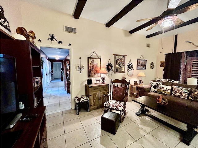 tiled living room featuring ceiling fan and beamed ceiling