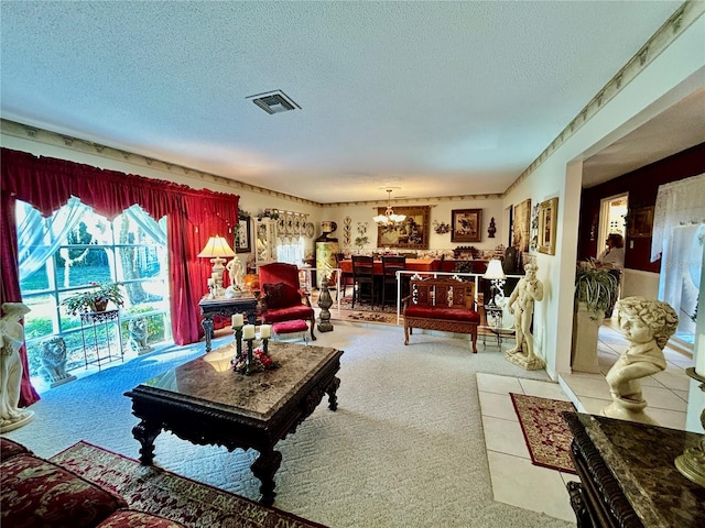 living room featuring light colored carpet, a textured ceiling, and a chandelier