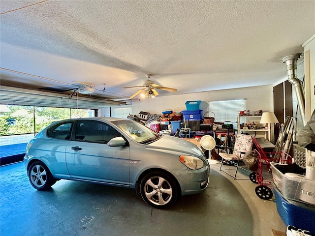 garage featuring a garage door opener and ceiling fan