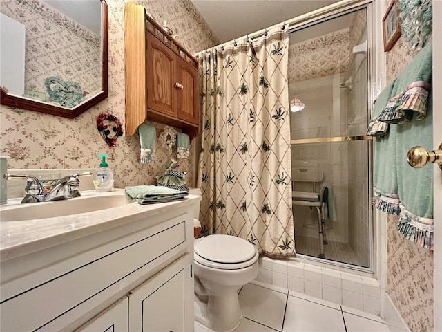 bathroom with tile patterned flooring, a shower with curtain, vanity, and toilet