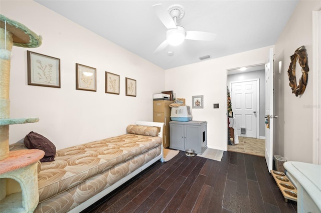 interior space with dark hardwood / wood-style floors and ceiling fan