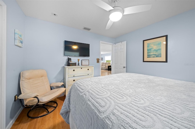 bedroom featuring light hardwood / wood-style flooring and ceiling fan