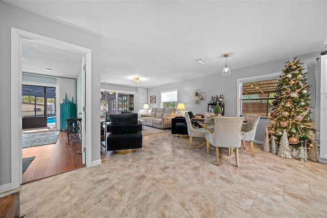 dining space with light wood-type flooring