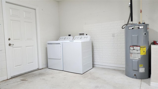 washroom featuring separate washer and dryer and water heater