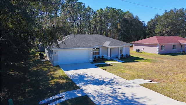 ranch-style home with a front yard and a garage