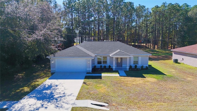 single story home with a garage and a front yard