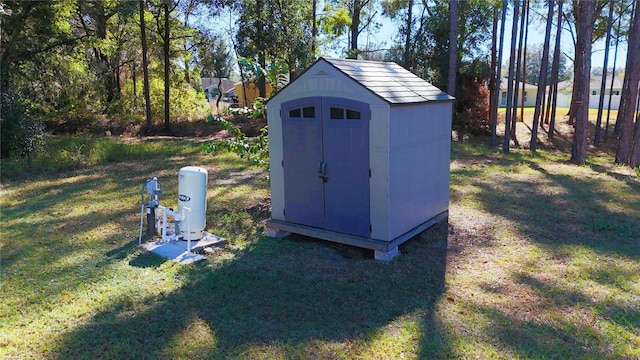 view of outdoor structure with a yard