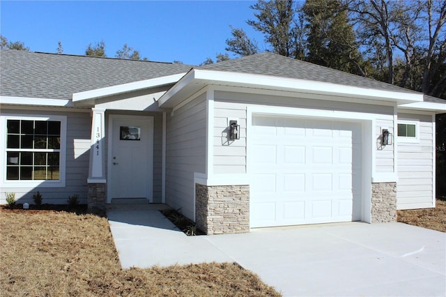 view of exterior entry with a garage