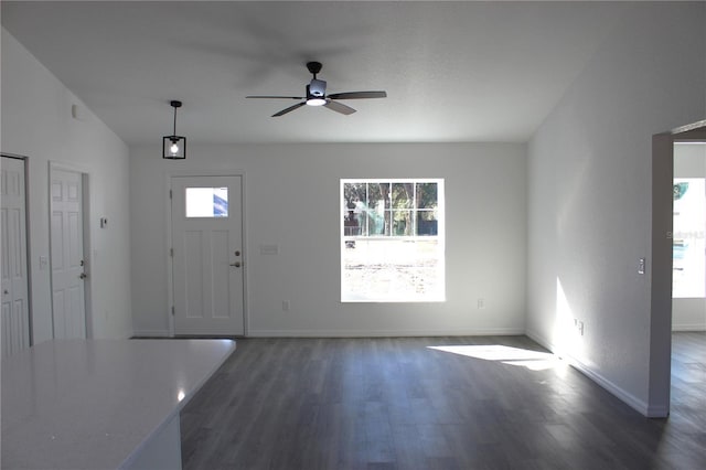 entryway with dark hardwood / wood-style flooring and ceiling fan