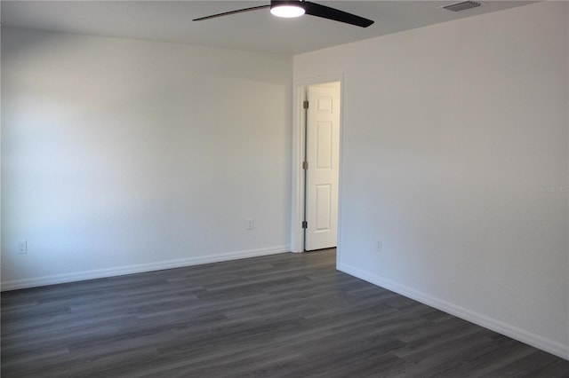 unfurnished room featuring dark hardwood / wood-style floors and ceiling fan