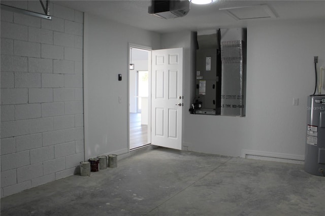 garage featuring water heater, a garage door opener, and heating unit